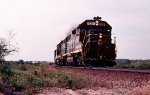 Seaboard Coast Line GP38-2's #529 & 551 and U30B 1700, smoking heavily, leads 323's train southbound 